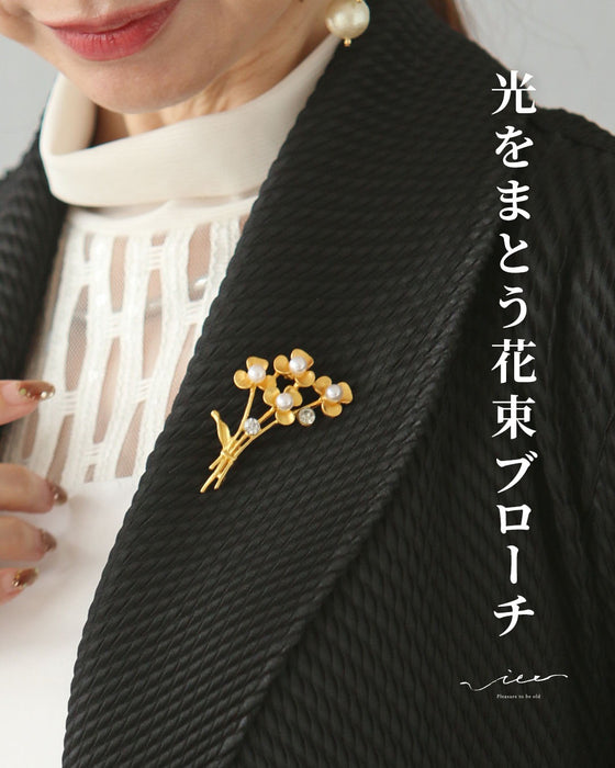 光をまとう花束ブローチ