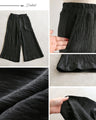 素材で差がつく 艶めく黒ワイドパンツ