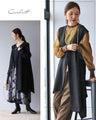 A striking black vest and pants outfit set