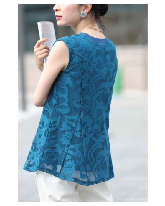 アラベスク模様浮き立つペプラムトップス