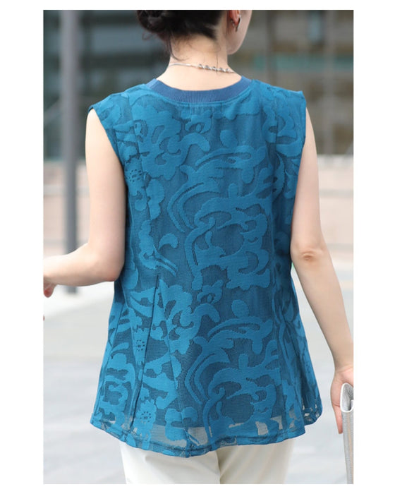 アラベスク模様浮き立つペプラムトップス