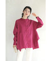 A collared shirt top with ruffles flowing from the back