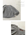 A short outerwear with puffy sleeves