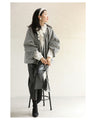 A short outerwear with puffy sleeves