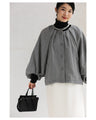 A short outerwear with puffy sleeves