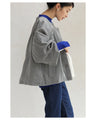 A short outerwear with puffy sleeves