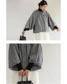 A short outerwear with puffy sleeves