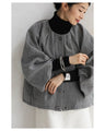 A short outerwear with puffy sleeves