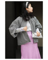 A short outerwear with puffy sleeves
