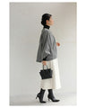 A short outerwear with puffy sleeves