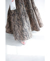 A long skirt with a fluttering animal print art style