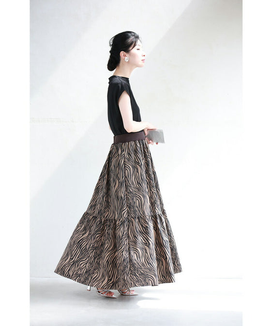A long skirt with a fluttering animal print art style