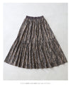 A long skirt with a fluttering animal print art style
