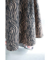A long skirt with a fluttering animal print art style