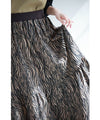A long skirt with a fluttering animal print art style