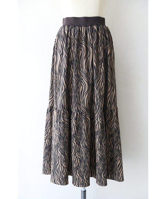 A long skirt with a fluttering animal print art style