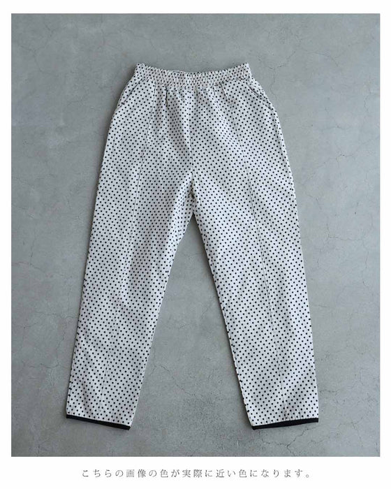 パイピング裾のドット柄テーパードパンツ