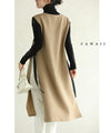 Long vest with side slits and a striking pattern
