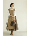 Long vest with side slits and a striking pattern