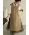 Long vest with side slits and a striking pattern