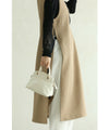 Long vest with side slits and a striking pattern