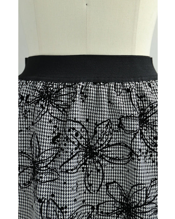 フロッキーの黒花画ロングスカート