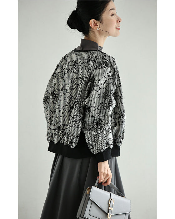 フロッキーの黒花画ブルゾン