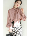 (With ribbon) A glossy blouse top that adds a touch of elegance
