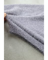 A stretchy knit cardigan with a sparkly brushed finish