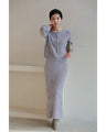 A stretchy knit cardigan with a sparkly brushed finish