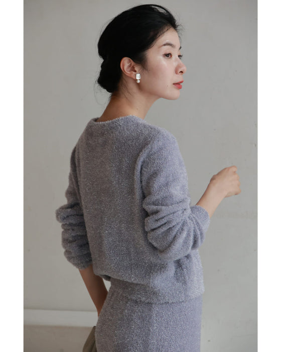 A stretchy knit cardigan with a sparkly brushed finish