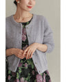 A stretchy knit cardigan with a sparkly brushed finish