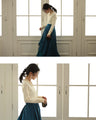 A fluffy knit top with finely sparkling sequins and fluffy collar and sleeves