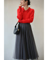 A fluffy knit top with finely sparkling sequins and fluffy collar and sleeves