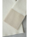 A fluffy knit top with finely sparkling sequins and fluffy collar and sleeves