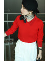A fluffy knit top with finely sparkling sequins and fluffy collar and sleeves