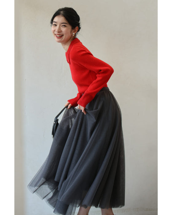 A fluffy knit top with finely sparkling sequins and fluffy collar and sleeves