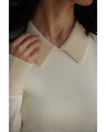 A fluffy knit top with finely sparkling sequins and fluffy collar and sleeves