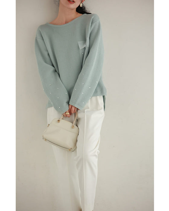 袖に輝くビジューとシアーポケットのニットプルオーバートップス