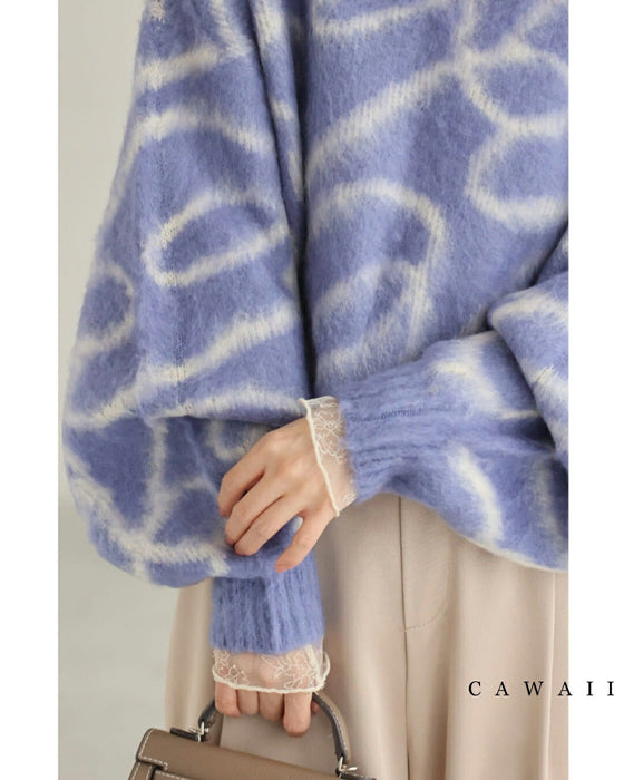 揺らめくリボン柄の起毛ニットプルオーバートップス