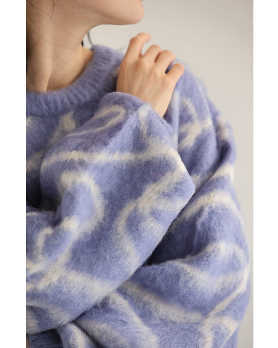 揺らめくリボン柄の起毛ニットプルオーバートップス