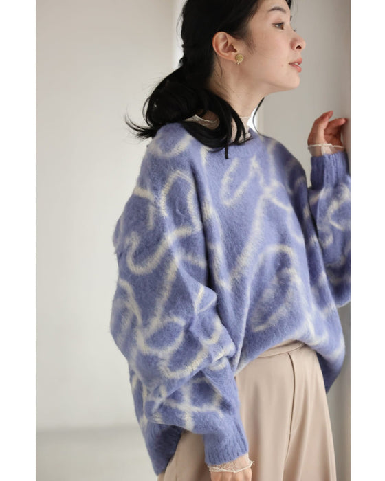 揺らめくリボン柄の起毛ニットプルオーバートップス