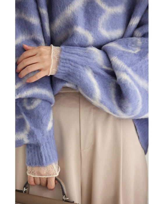 揺らめくリボン柄の起毛ニットプルオーバートップス