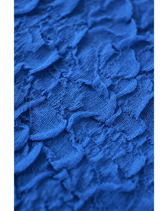 鮮やかな青の水面プルオーバートップス