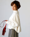 Stand out from the crowd! A light-colored flared blouse with a modern silhouette