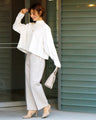 Stand out from the crowd! A light-colored flared blouse with a modern silhouette