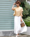 Goes great with skirts! A short, flared top that makes your legs look longer just by wearing it.
