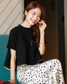Goes great with skirts! A short, flared top that makes your legs look longer just by wearing it.