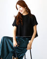 Goes great with skirts! A short, flared top that makes your legs look longer just by wearing it.