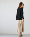 For winter to spring coordination: A knit cut-off sleeve top for adults that can be worn across the seasons